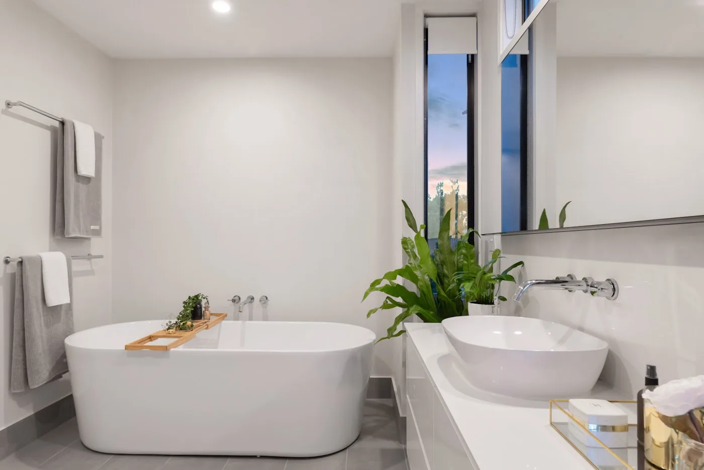 AI bathroom remodel — modern white bathroom with freestanding tub and floating vanity.