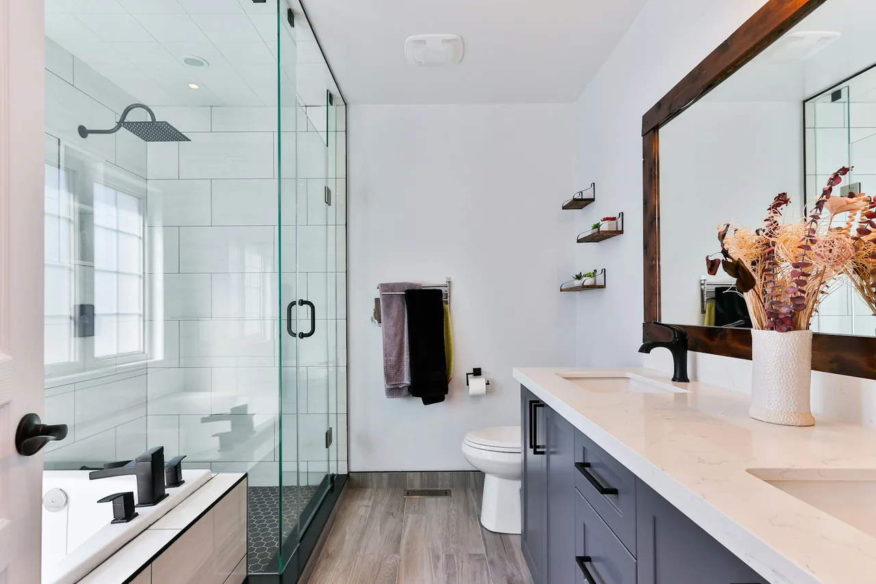 Double-sink shaker bathroom vanity with black faucets and quartz counter previewed for AI fixture swap.