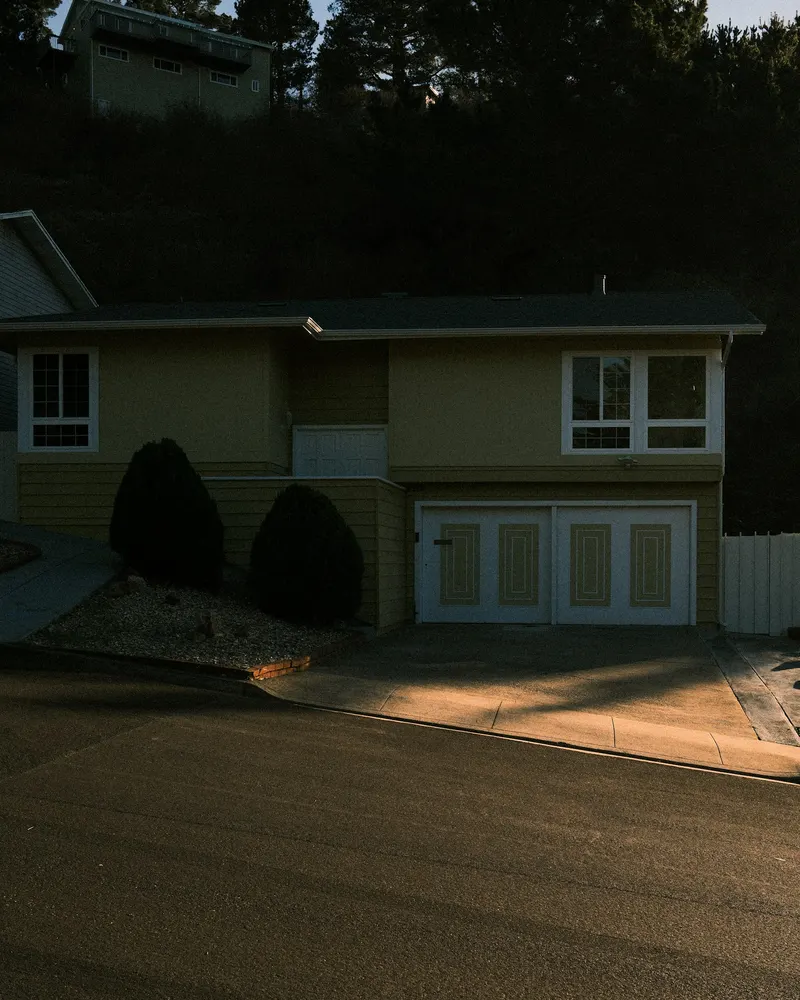 Suburban American home with attached garage — typical homeowner facade evaluated before a costly exterior renovation